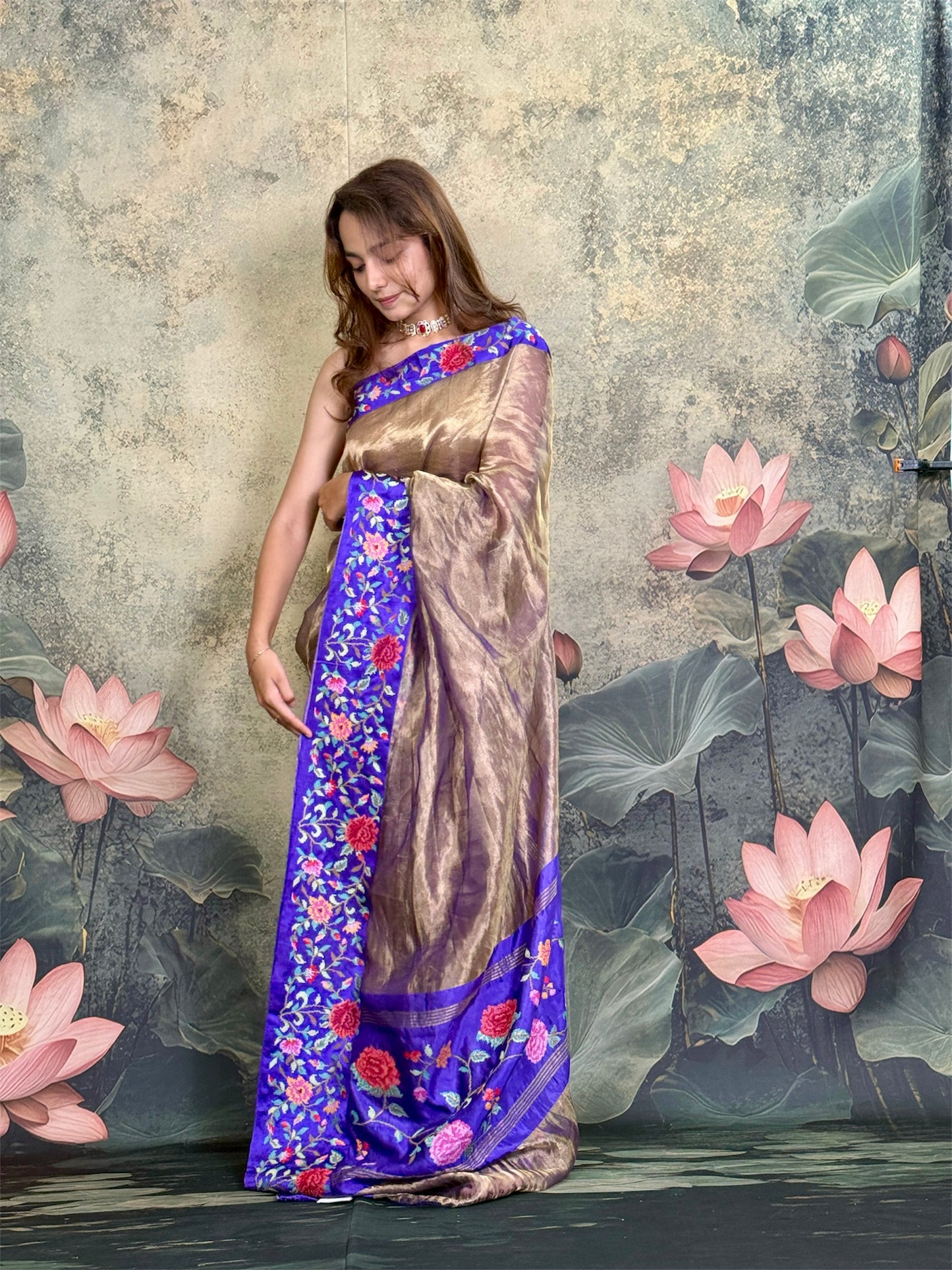 Pure tissue silk saree with petit point work and mashroo satin border.