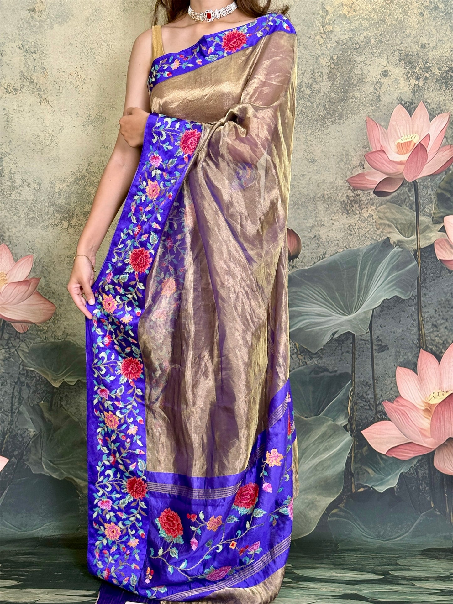 Pure tissue silk saree with petit point work and mashroo satin border.